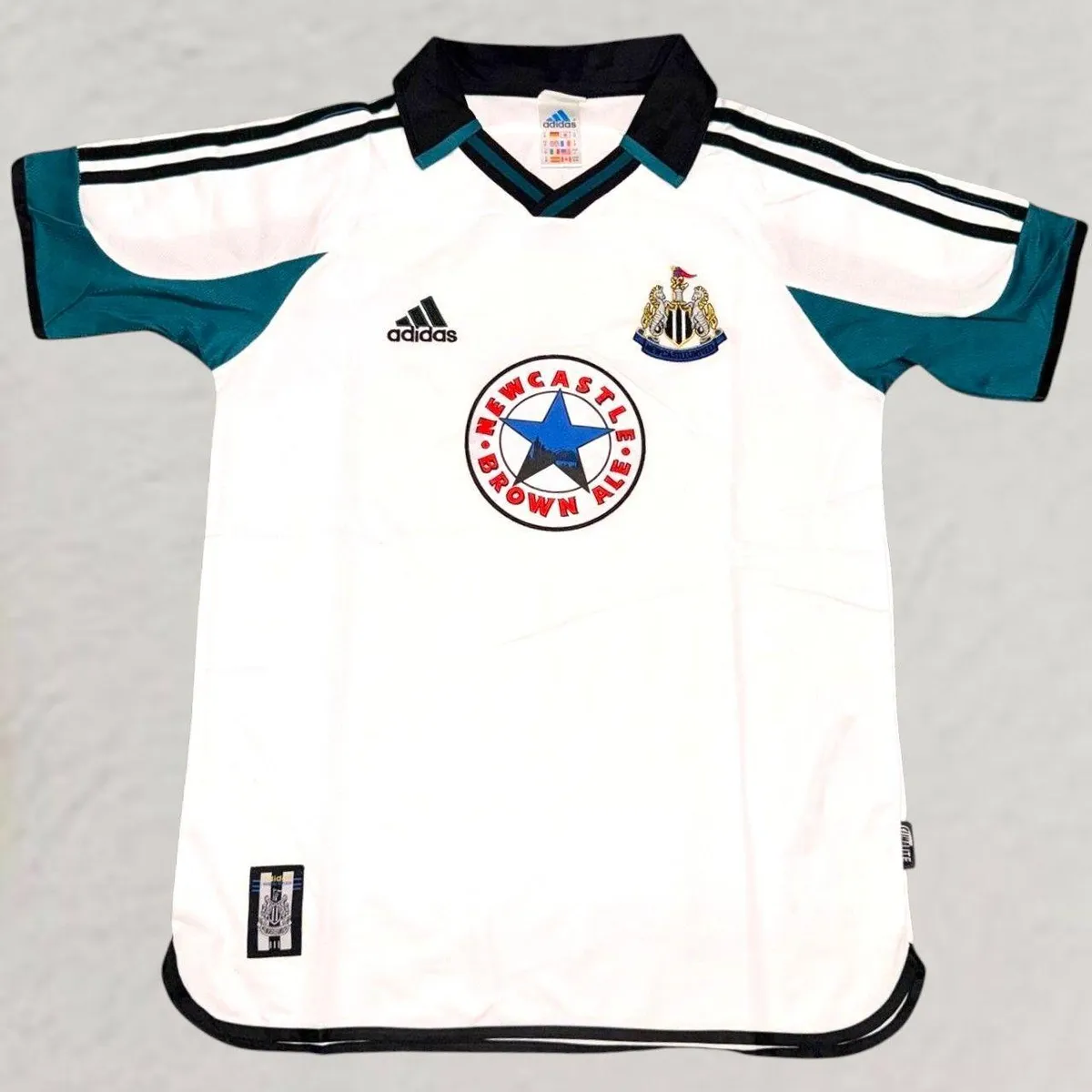 Newcastle United 1999-00 Away Shirt in white, teal, black